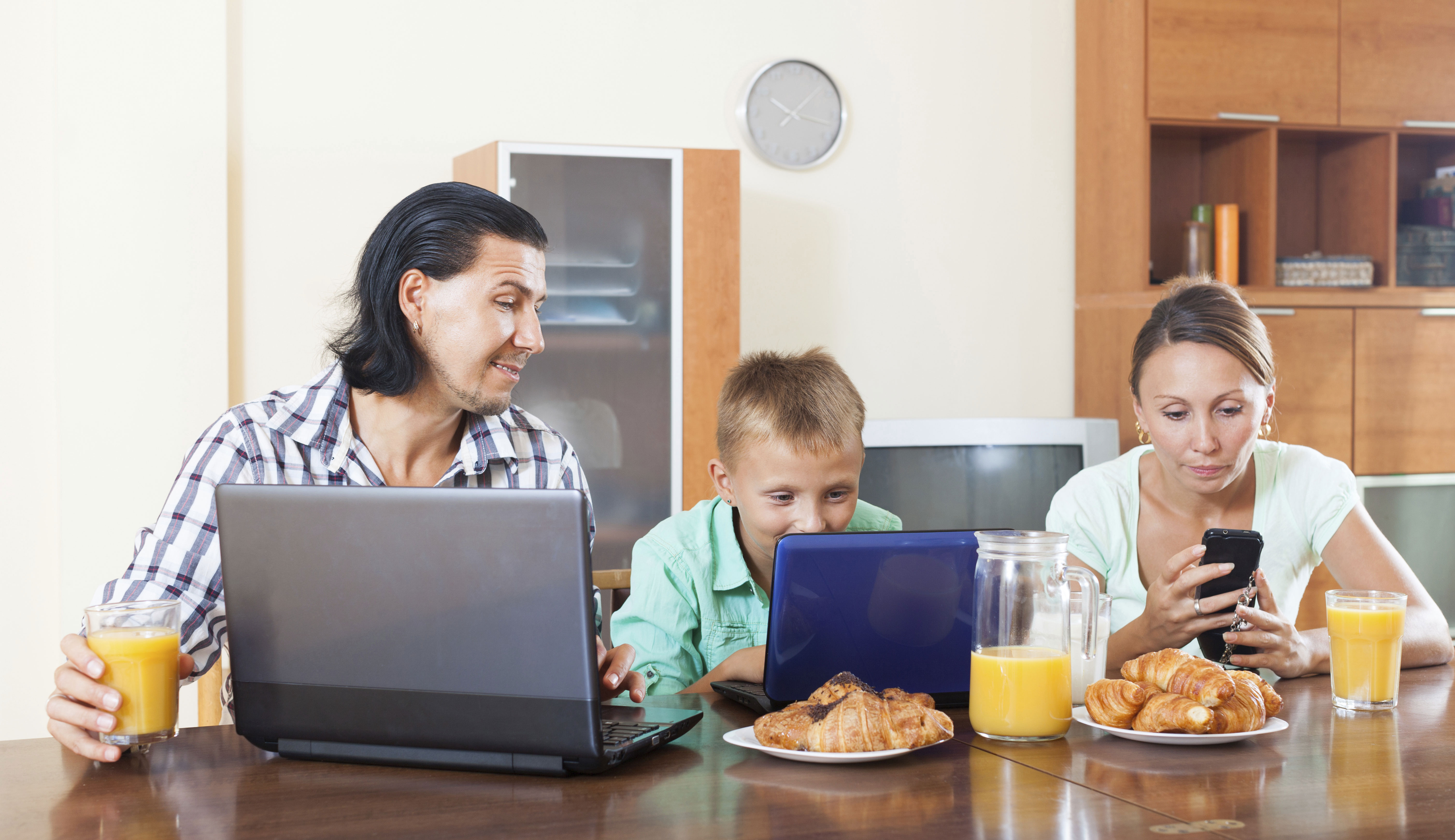 family using internet devices